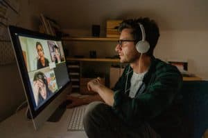 IT manager has video conference with his offshore development team.